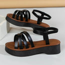 Schicke und bequeme schwarze Sandalen mit Kreuzriemen